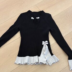 Black Ribbed Sweater with Cream Ruffle Trim